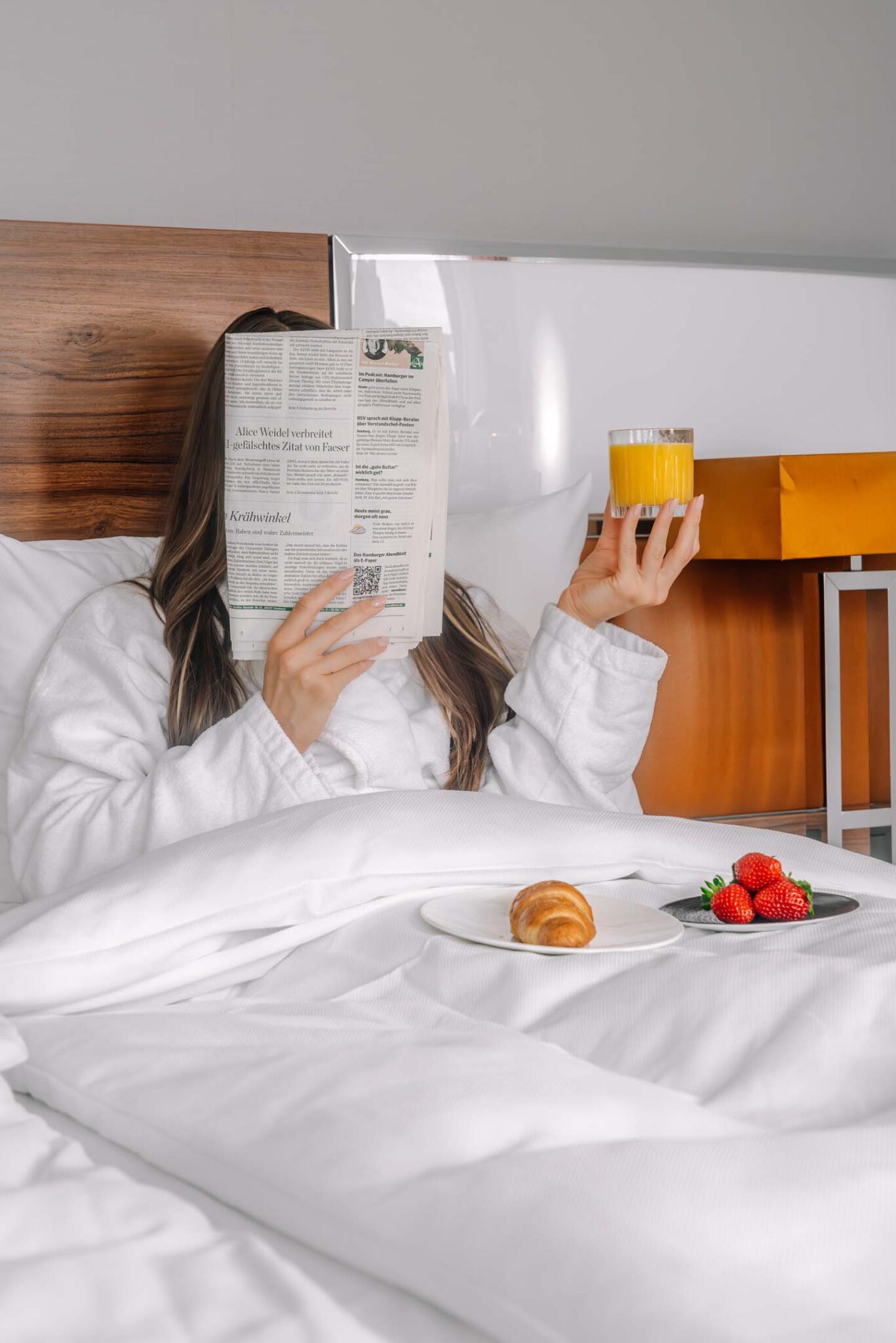 Guest enjoying breakfast in bed