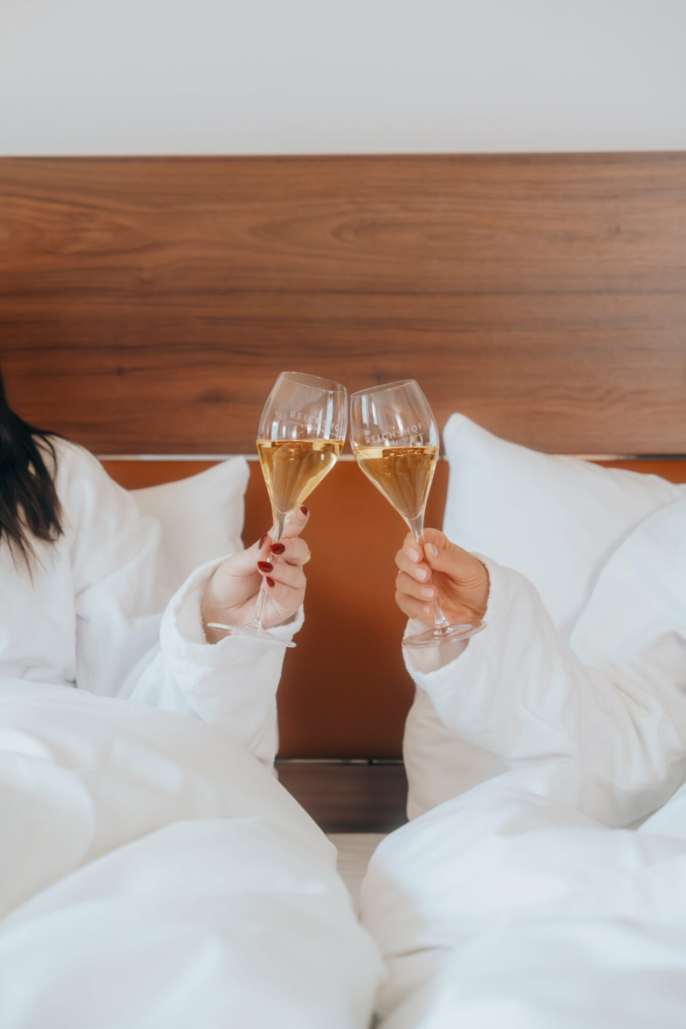Hands with glasses of sparkling wine